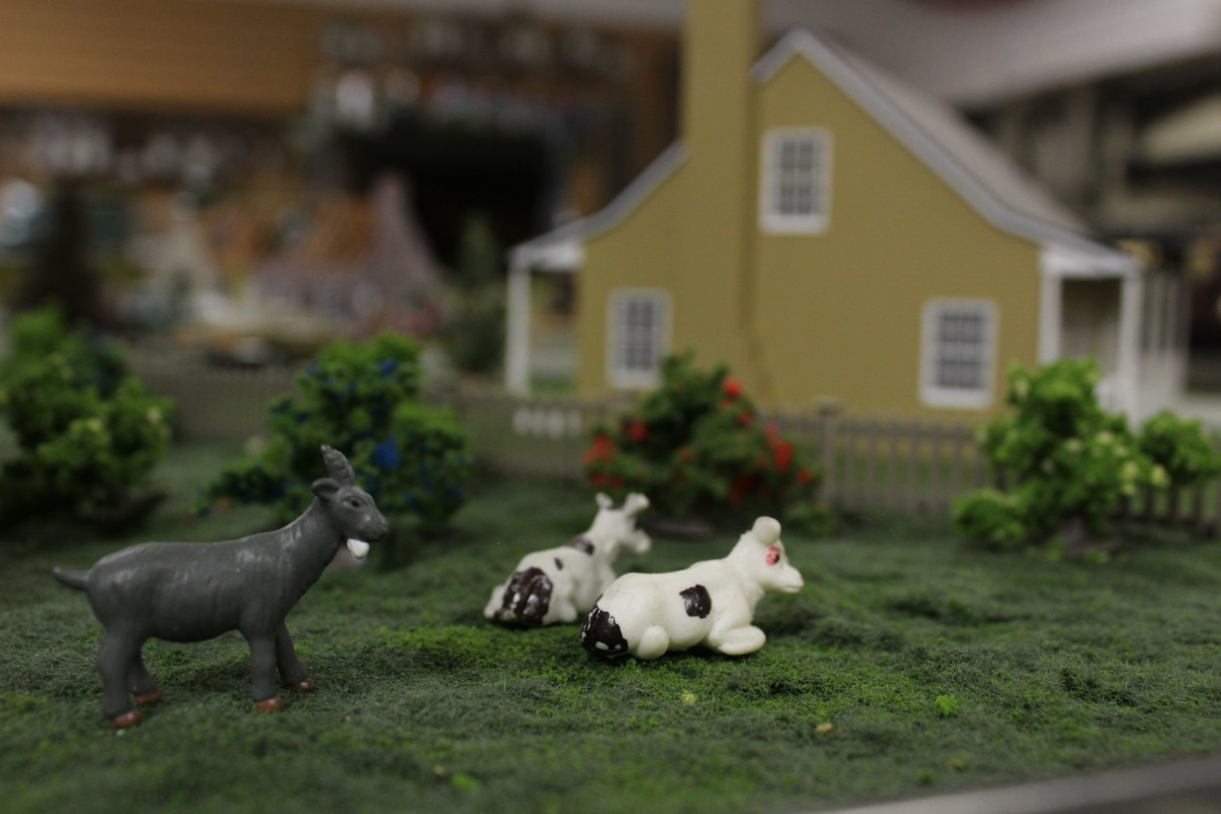 Goat and cows dot model train scene